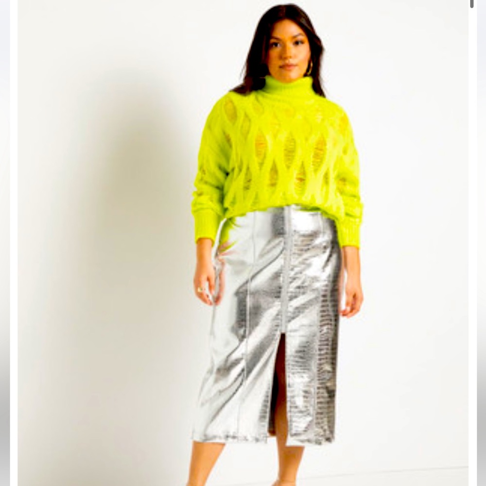 Silver Metallic leather skirt with front slit. Never worn with tags . Size 16/18